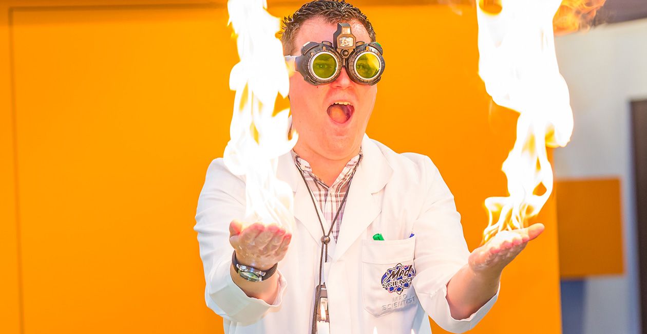 Mad scientist with fire in both hands