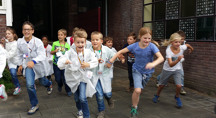 Kids in mad science lab coats running out of school
